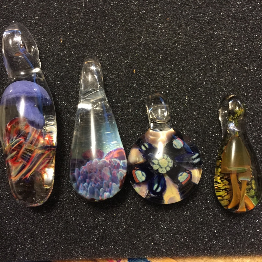Set of 4 blown glass pendants.